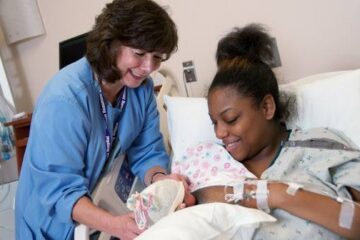 holding a baby after giving birth