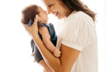 Happy, smiling mother holding her baby